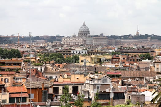 Cityscape of Rome, Italy with prominent Basilica San Pietro in Vatican.