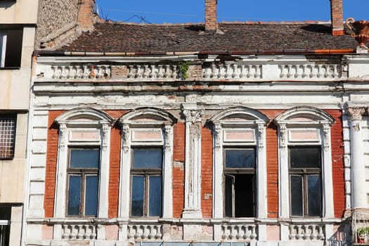 Vidin, Bulgaria - old apartment building. Windows close-up.
