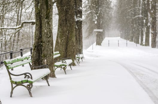 Snow covered benches on top of Ljubljana castle hill.