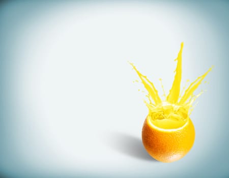 ice cubes fall into the orange, spray and splashes of juice