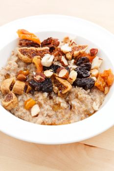 oatmeal with raisins, nuts and maple syrup