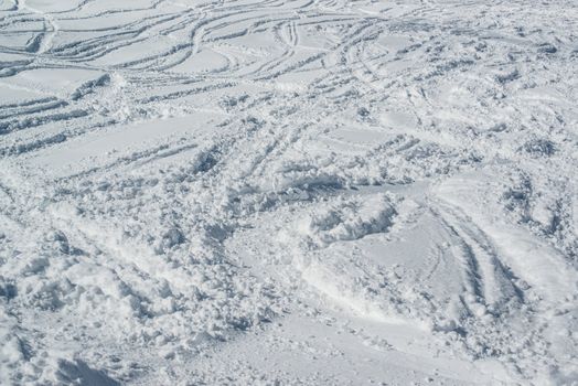 Ski tracks in the powder snow - skiing background