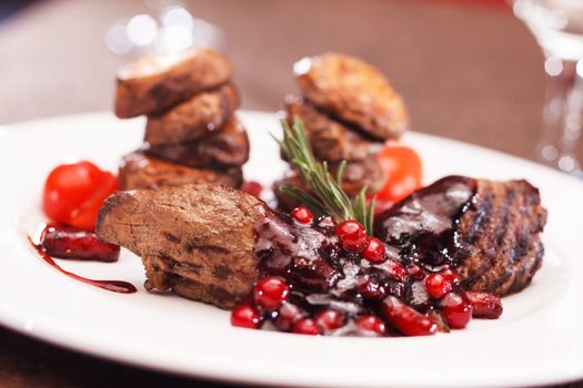 beef steak with potatoes and cranberry sauce