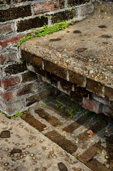 Old patio and garden seating made of brick and stone