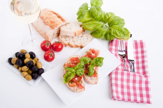 deliscious fresh bruschetta appetizer with tomatoes isolated on white background