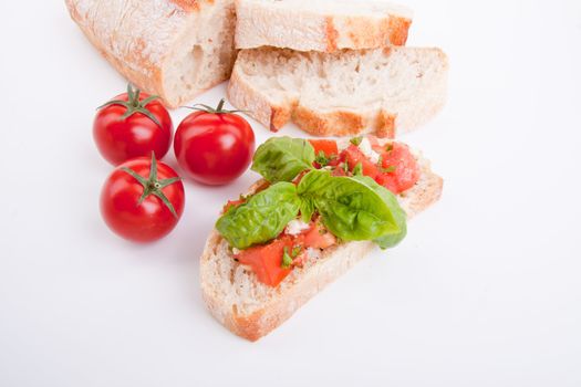 deliscious fresh bruschetta appetizer with tomatoes isolated on white background