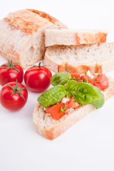 deliscious fresh bruschetta appetizer with tomatoes isolated on white background