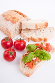 deliscious fresh bruschetta appetizer with tomatoes isolated on white background