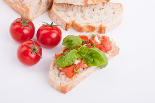 deliscious fresh bruschetta appetizer with tomatoes isolated on white background