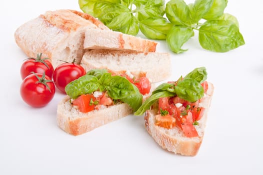 deliscious fresh bruschetta appetizer with tomatoes isolated on white background