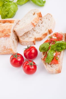 deliscious fresh bruschetta appetizer with tomatoes isolated on white background