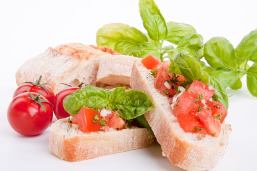 deliscious fresh bruschetta appetizer with tomatoes isolated on white background