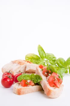 deliscious fresh bruschetta appetizer with tomatoes isolated on white background