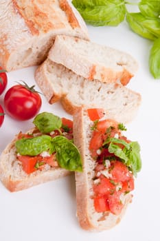 deliscious fresh bruschetta appetizer with tomatoes isolated on white background