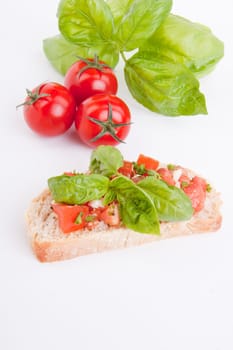 deliscious fresh bruschetta appetizer with tomatoes isolated on white background