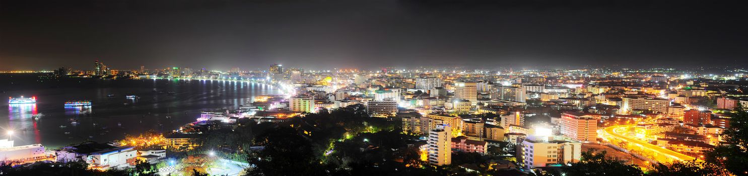 Pattaya, Thailand - March 02, 2013: Panorama of Pattaya at night. Pattaya is a most popular tourist attraction. Almost 20 million tourists visited Thailand in 2012. 