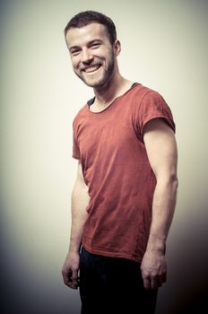 vintage portrait of smiling fashion guy on gray background