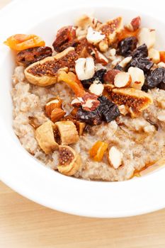 oatmeal with raisins, nuts and maple syrup