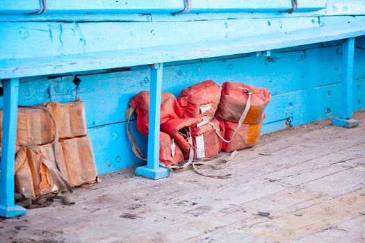 Dwarka Roadtrip. Life belt jacket under the seat on a passenger ferry in India. Generic horizontal shot, location, Bet Dwarka, Gujarat, India