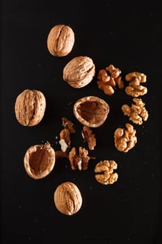 walnuts on black background