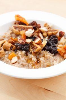 oatmeal with raisins, nuts and maple syrup