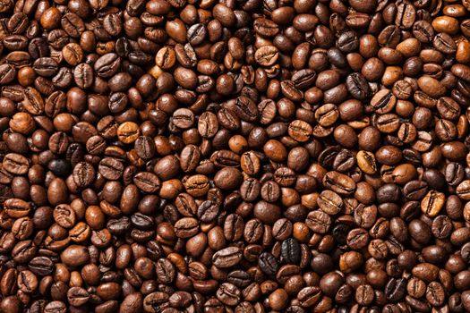 Brown roasted raw coffee bean heap background