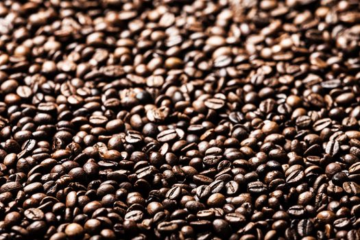 Brown roasted raw coffee bean heap background