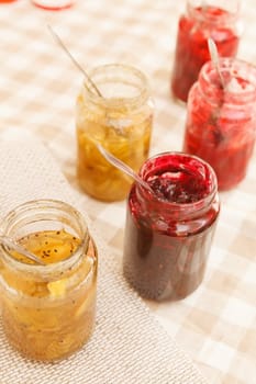 different jars full of fruity jam