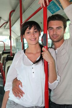 Couple riding the bus together