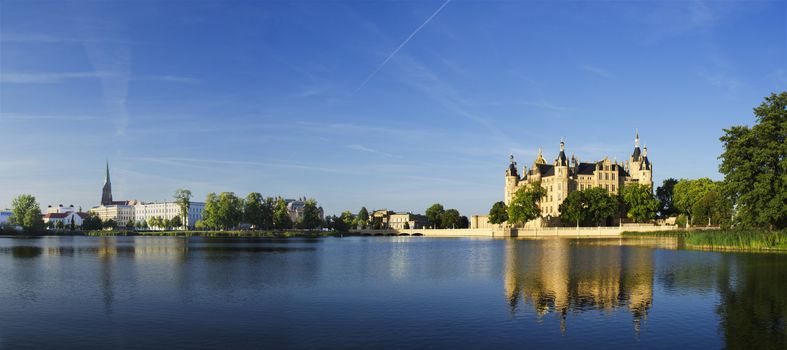 Panorama view over the Burgsee towards the Schwerin Castle. The Schwerin Castle is the seat of the state parliament of Mecklenburg-Vorpommern.