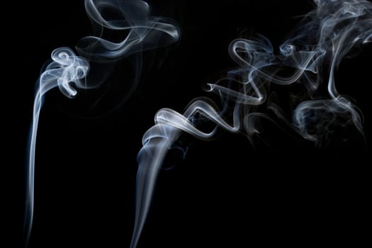 Two streams of abstract smoke trail, shapes and form.