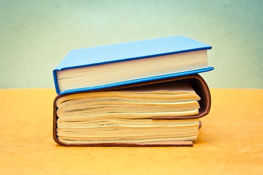 Two books in pastel tones as a still life image