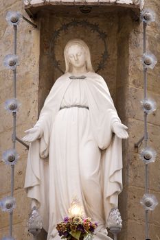 Statue of Virgin Mary on a building in Valletta, Malta