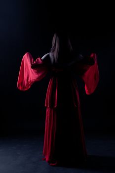 Young girl dancer in a darkness before start

