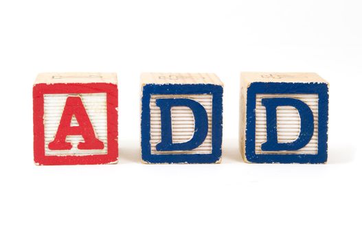 Children's wooden blocks "ADD" Attention Deficit Disorder on white background