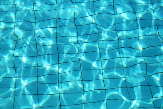 The texture of the tiles in the pool