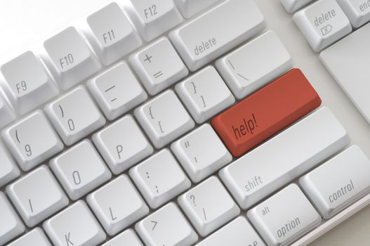 Red computer key with the word help on it.