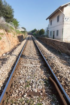 Straight train tracks in Alberobello Italy on a sunny day