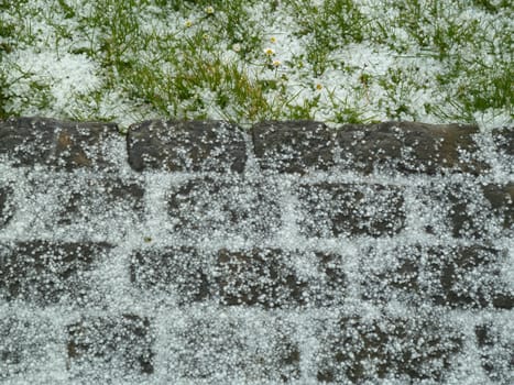 different surfaces covered with hail stones