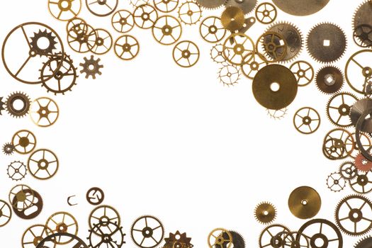 Watch cogs on white forming a frame with copy space in center