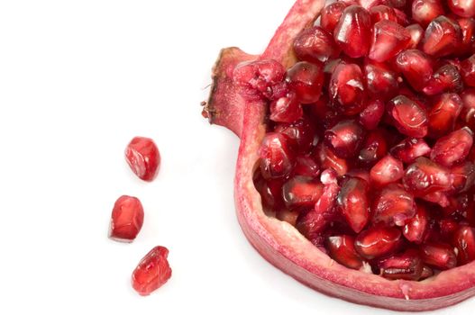 Pomegranate seeds and shell isolated on white background