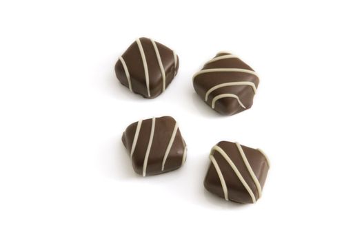 Four chocolates isolated on a white background