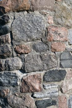 Stone background of a stone foundation from a century style turret with copy space 