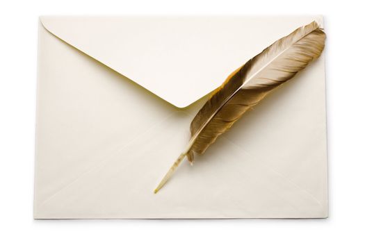 Envelope and feather isolated on white