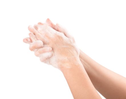 A woman washes her hands with soap. Isolated on white.