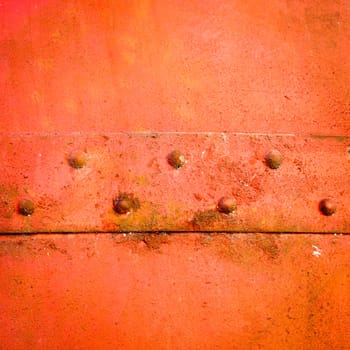 Textured rusty metal construction plate as a background