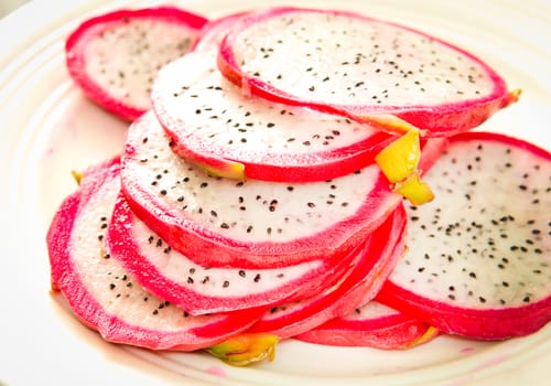 Succulent fresh dragon fruit sliced on a plate