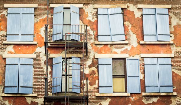 Shutters on the exterior wall of an old city building