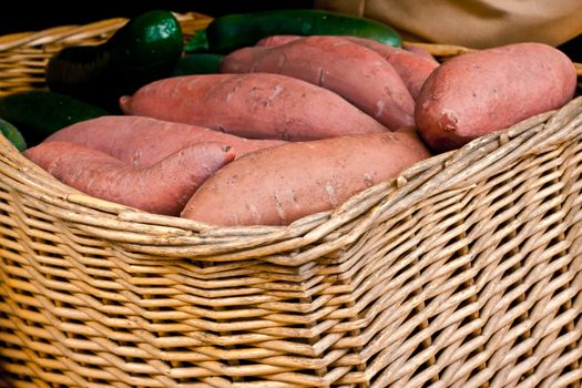 Freshly harvested sweet potatoes in a basket