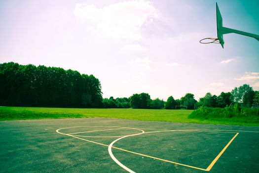 A basketball court in striking dramatic colours